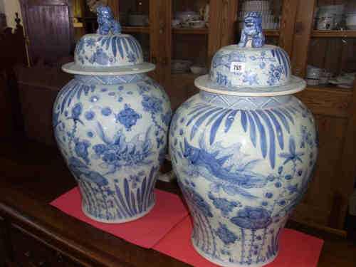 Pair Large Blue and White Lidded Vases, decorated with fish and fauna and the lids with dogs of Fo