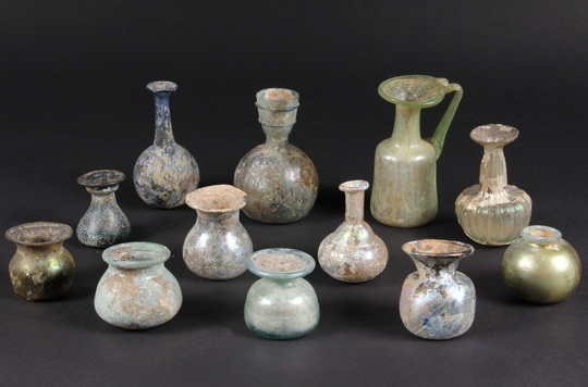 (12) SMALL ROMAN GLASS JARS - Twelve Jars in various forms and colors ranging from spherical to