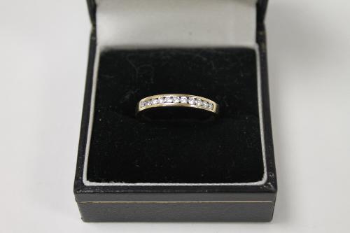 A 9ct gold diamond half eternity ring. CONDITION REPORT: Good condition.