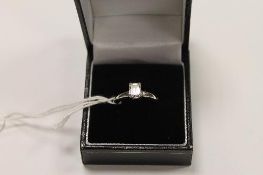 A platinum emerald-cut solitaire diamond ring, 1.01ct, colour F, clarity Vs1. CONDITION REPORT: Good