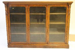 A Victorian walnut triple door bookcase, width 186 cm. CONDITION REPORT: Good condition.