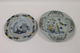 Two eighteenth century tin-glazed Delft chargers. (2) CONDITION REPORT: Width 34 cm and 30 cm.