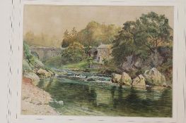 Ralph Hedley : A house on a river's edge with an arched bridge beyond, watercolour, signed with