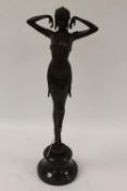 After Demetre H.Chiparus - A bronze figure of an Art Deco style lady, on marble socle, height 48 cm.