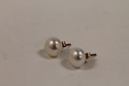 A pair of 9ct gold pearl earrings. (2) CONDITION REPORT: Each pearl approximately 9mm diameter.