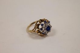 A 9ct gold cluster ring set with blue gemstones. CONDITION REPORT: Good condition.
