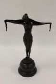 After Demetre H. Chiparus - A bronze figure of an Art Deco style lady  with a head scarf, on