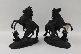 A pair of late nineteenth century spelter figures modelled as rearing horses, height 40 cm. (2)