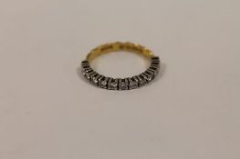 A 22ct gold diamond half eternity ring. CONDITION REPORT: Good condition.