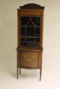 An Edwardian inlaid mahogany display cabinet, width 66 cm. CONDITION REPORT: Fair condition, some