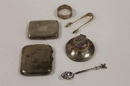 Two silver cigarette cases, together with a small silver inkwell, a napkin ring and continental