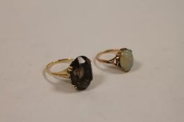 A 9ct gold opal dress ring, together with another 9ct gold ring. (2) CONDITION REPORT: Good