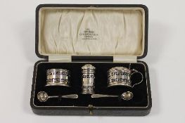 A five piece silver condiment set, Birmingham 1932, cased. CONDITION REPORT: Good condition.