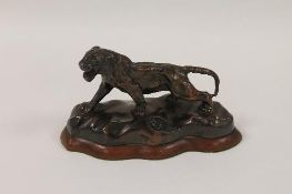 A bronze panther standing upon a shaped plinth, width 17.5 cm. CONDITION REPORT: The base with
