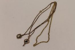 Three yellow metal necklaces with two pendants. (3) CONDITION REPORT: Good condition, late Victorian