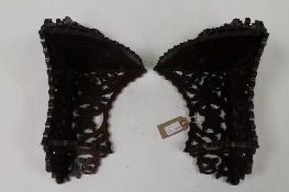 A pair of mahogany fret-work carved corner brackets. (2) CONDITION REPORT: Probably early