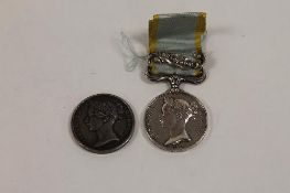 An 1854 Crimea medal with Sebastopol clasp on suspension ribbon awarded to F.Marsh 10th Hussars,