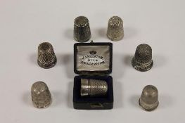 Six silver thimbles, together with a Charles Horner Dorcas thimble. (7) CONDITION REPORT: Good