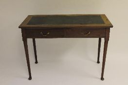 An early nineteenth century two drawer side table, width 107 cm. CONDITION REPORT: Standing on