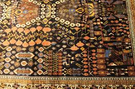 An Iranian fringed carpet, 154 cm x 224 cm. CONDITION REPORT: Good condition.