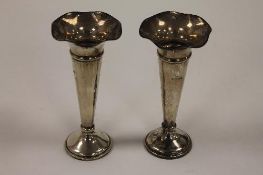 A pair of silver fluted vases, London 1859. (2) CONDITION REPORT: Loaded bases and with small crease
