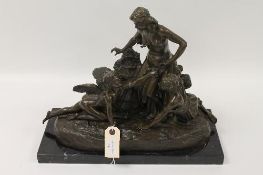 After Joe Descomps  -  A bronze figured group depicting two maidens and a cherub, on black marble
