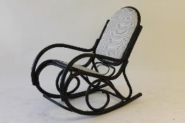 An early twentieth century Bentwood rocking chair. CONDITION REPORT: Good condition.