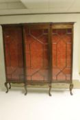 A breakfronted mahogany triple door display cabinet, width 181 cm. CONDITION REPORT: Good condition.