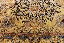 An Iranian fringed carpet, 395 cm x 303 cm. CONDITION REPORT: Good condition.