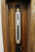 A Negretti & Zambra Marine Barometer, in an oak and panelled glass display case. CONDITION REPORT: