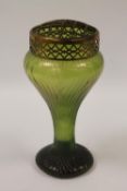 A late nineteenth / early twentieth century iridescent glass flower vase, height 22.5 cm.