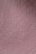 An early twentieth century hand stitched Durham quilt - pink. CONDITION REPORT: Good.