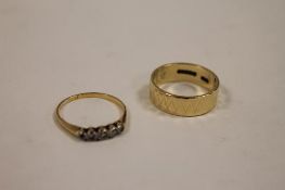 A 9ct gold wedding band, 3.3g, together with a five-stone diamond ring. (2) CONDITION REPORT: Good