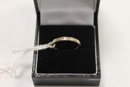 An 18ct gold princess-cut diamond eternity ring. CONDITION REPORT: Good condition.