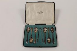A set of six silver teaspoons and pair of sugar tongs, Walker & Hall, Sheffield 1933, cased.