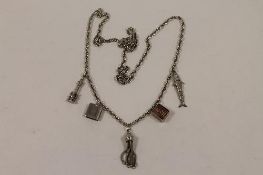 A sterling silver necklace with charms. CONDITION REPORT: Good condition.
