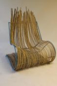 A twentieth century bamboo over-sized garden chair, width 105 cm. CONDITION REPORT: Good
