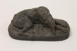 A bronze study of a hound, length 15 cm. CONDITION REPORT: Contemporary item in good condition.