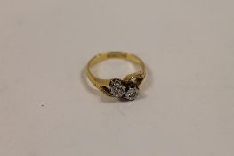 An 18ct gold two-stone diamond ring. CONDITION REPORT: Good condition.