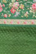 An early twentieth century hand stitched traditional floral quilt. CONDITION REPORT: Good.