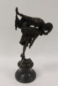 After Demetre H. Chiparus - A bronze Art Deco style lady with a serpent at her feet, on marble