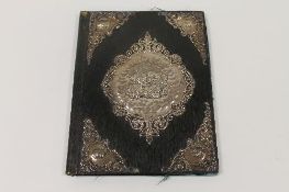 A late Victorian silver mounted leather album, Birmingham 1897. CONDITION REPORT: The silver