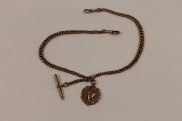 A 9ct gold Albert chain with shield fob, 40 g. CONDITION REPORT: Good condition.
