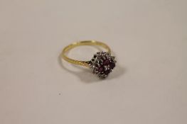 An 18ct gold ruby and diamond ring. CONDITION REPORT: Good condition.