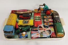 A large collection of tin plate and mechanical toys. (Q) CONDITION REPORT: Large lot comprising