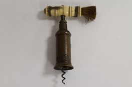 A nineteenth century Thomason cork screw, with bone handle and brush. CONDITION REPORT: Good