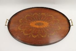 An Edwardian inlaid mahogany oval tray, width 68 cm. CONDITION REPORT: With surface split to the