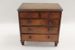 A Victorian mahogany apprentice type miniature chest of five drawers, height 28 cm. CONDITION