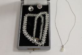 A sterling silver and crystal necklace, with matching earrings, together with a pearl pendant on