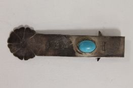 A silver bookmark, Birmingham 2000, set with a turquoise stone. CONDITION REPORT: Good condition.